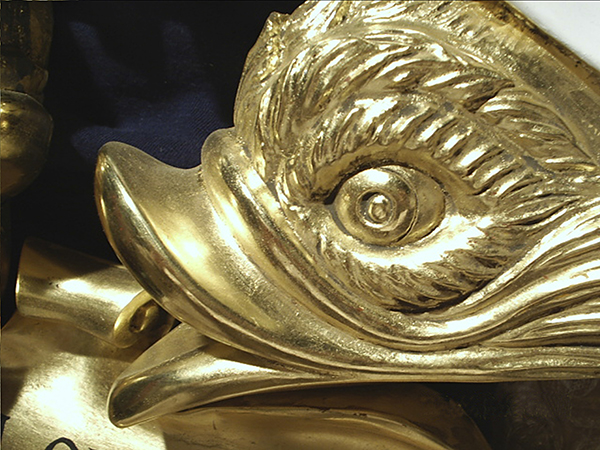 Carved and gilt heraldic dolphin