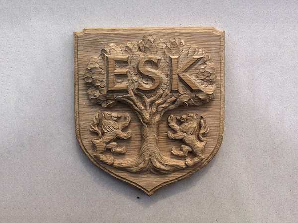 Carved heraldic shield - ESK school